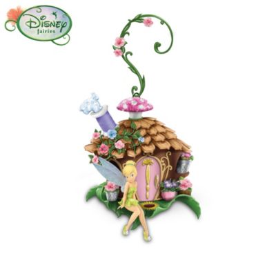 It's like no place you've ever been. Enter Pixie Hollow, the magical world of Tinker Bell and friends with this Disney Tinker Bell fairy house collection. Handcrafted and hand-painted, each adorable fairy house in this collection is decorated in the unique personality of the pixie who lives there. Each Disney Fairies character is crafted with lifelike features, and sparkles with pixie dust on her delicate wings. Your collection begins with Issue One, Imagine, followed by Issue Two, Tranquil, then Issue Three, Faith, and additional Pixie Hollow Tree House yard decorations, each a separate issue to follow.These Disney Fairies yard decorations from The Hamilton Collection can be used outdoors or indoors. This limited-edition collection is licensed by Disney, and was created with Disney artists. Each fairy house comes with a shepherd's hanger resembling climbing vines, so they blend in with nature surroundings. High demand is expected from Disney collectors, so order now!This fine home decor is not intended for children.