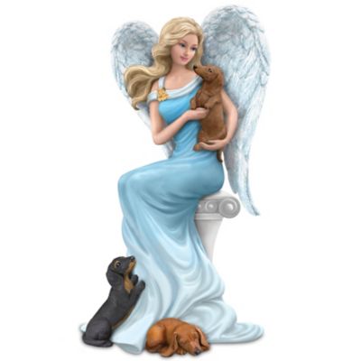 Angel holding dog store figurine