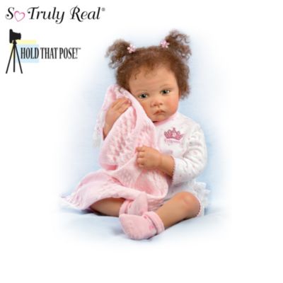 How many times have you seen a baby look so unbelievably adorable, you just wanted to say "Hold that pose!" Now you can, thanks to the breakthrough Hold That Pose technology found in this collection of vinyl baby dolls - the first-ever Hold That Pose doll collection, available only from The Ashton-Drake Galleries. Created by Master European Doll Artist Waltraud Hanl, your collection begins with Issue One, Sweet Princess. Soon, your collection will be complete with Issue Two, Night Night Kisses, a sweet baby boy ready to be cradled in your arms. Each issue will arrive separately.‡Each a stunning vision of So Truly Real&reg; artistry, these poseable dolls are handcrafted in RealTouch&153; vinyl. Their soft features are painted by hand, from their round cheeks to their little fingers and toes. As the perfect finishing touch, each doll in this collection has soft, hand-rooted hair and is ready to snuggle in their cuddly pajamas. Enthusiastic demand is expected, so don't wait. Order now!