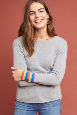 grey sweater with rainbow stripes