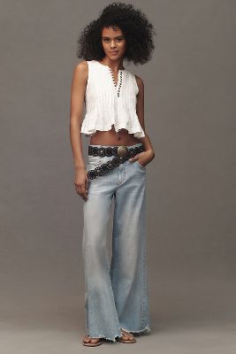 The Adi Regenerative Cotton Mid-Rise Frayed Relaxed Flare Jeans by Pilcro