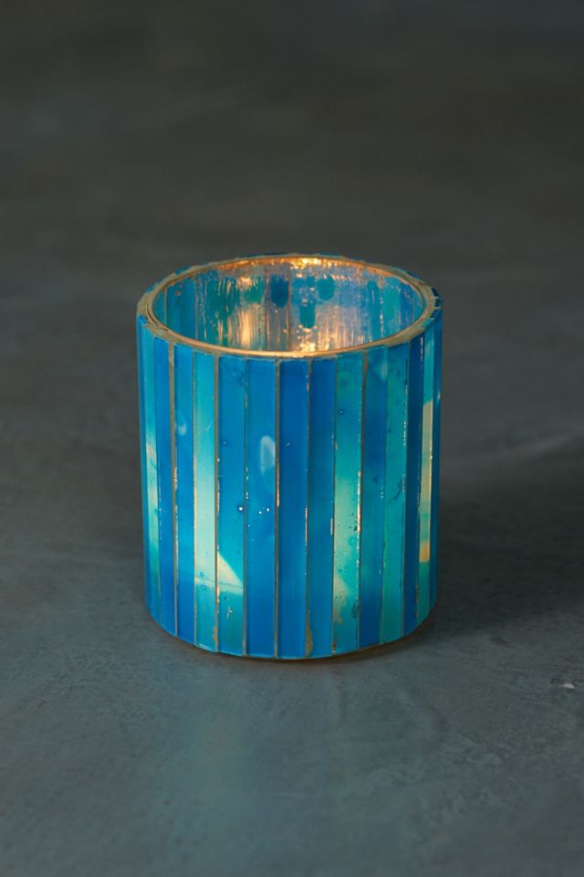 Decorative candle holders and votives enhance the mood in every room