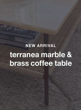 terranea onyx marble and brass metal 54" rectangular coffee table with wicker shelf