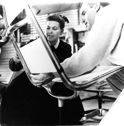 Charles and Ray Eames working on prototype