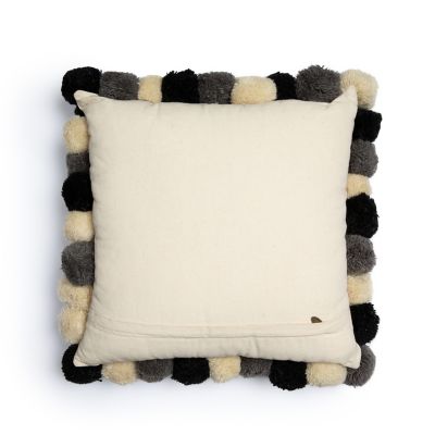 White pillow with black pom cheap poms