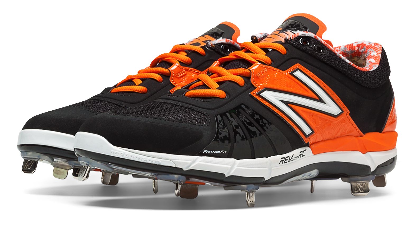 orange and black metal baseball cleats