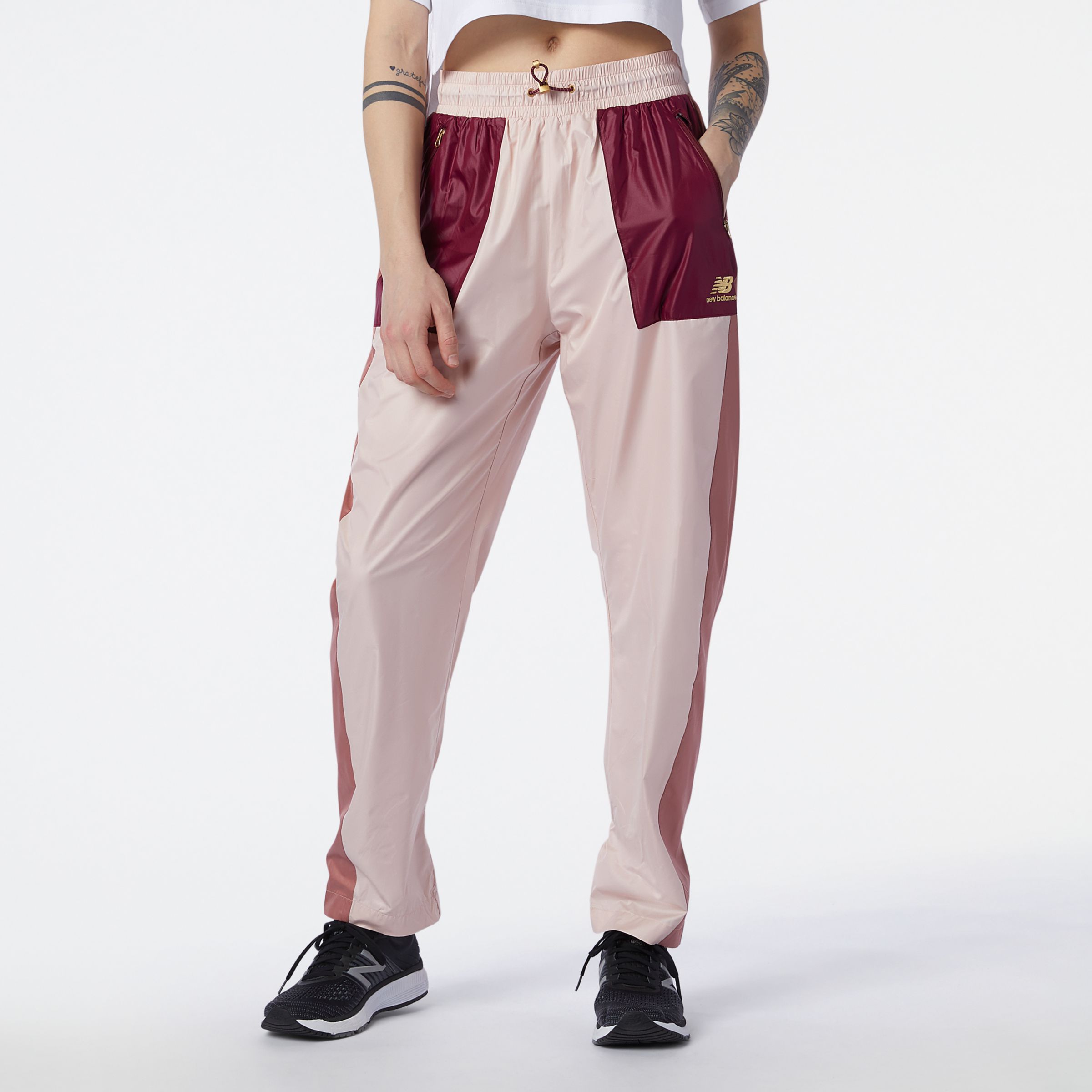 nb athletics higher learning wind pant