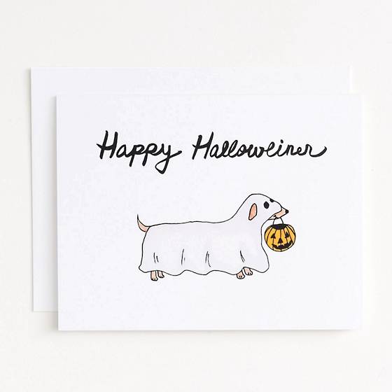 Weiner Dog Halloween Card featuring an illustrated dog covered in a white sheet holding a pumpkin basket.
