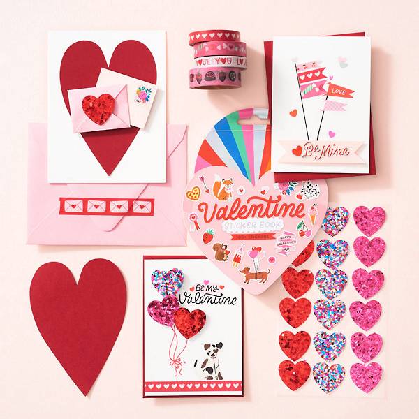 Assorted Valentine's Day crafts including paper hearts and stickers.