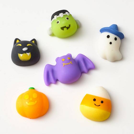 6 Squish toys including Frankenstein, a black cat, a ghost, a pumpkin, and a candy corn.