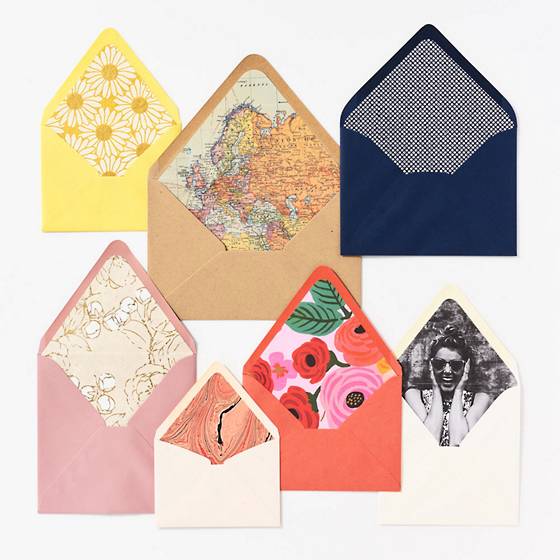 Colorful envelopes with custom made envelope liners using handmade paper.