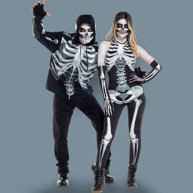 A man and woman dressed as skeletons
