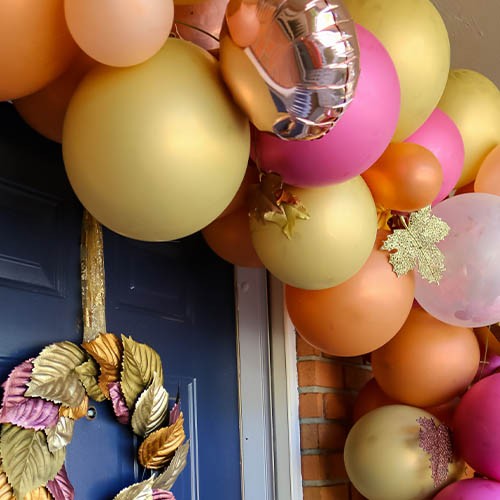 Detail fall balloon garland on a front door