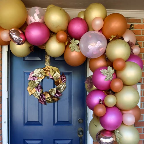 Fall balloon garland on a front door