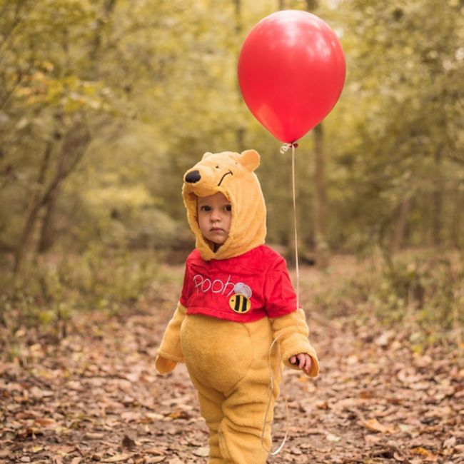 Child wearing Winnie the Pooh costume