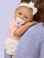4-piece outfit includes a matching headband and pacifier