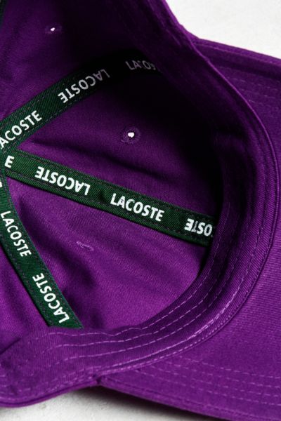 purple lacoste hat
