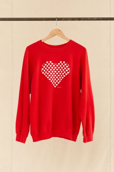 red sweatshirt with white heart