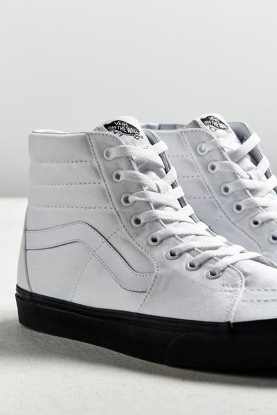 vans black sole white top