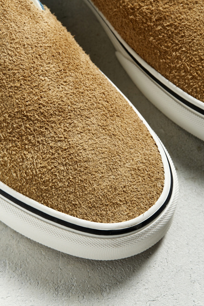 tan fuzzy slip on vans