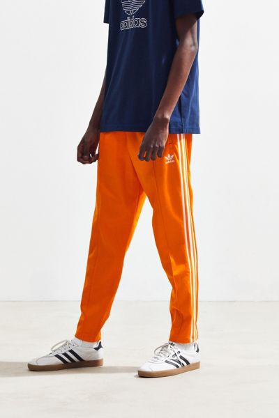 adidas beckenbauer track pants orange