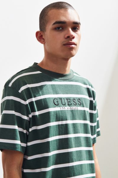 green and white guess shirt