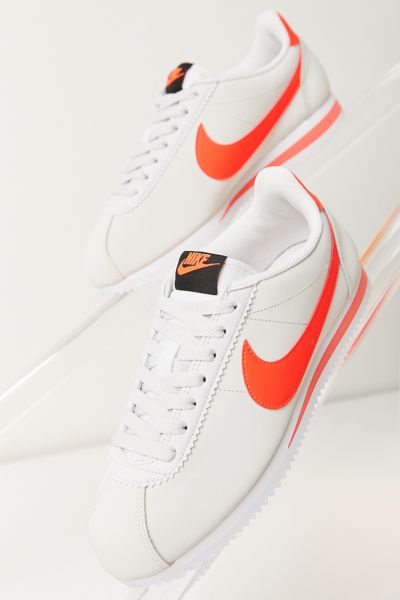 nike cortez orange and white