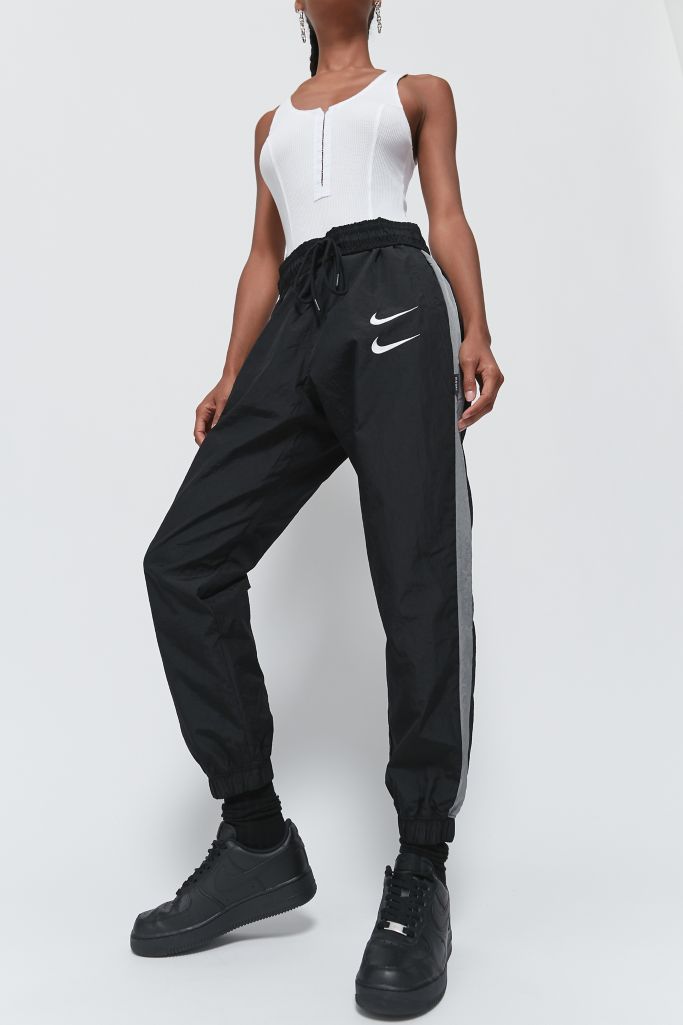 nike swoosh grey pants