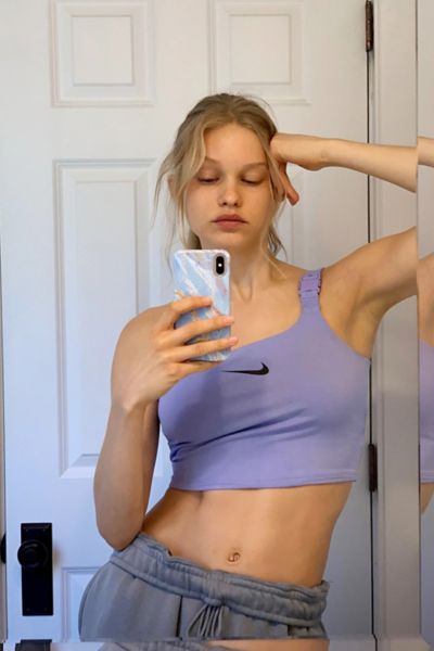 nike one shoulder buckle crop top in off white