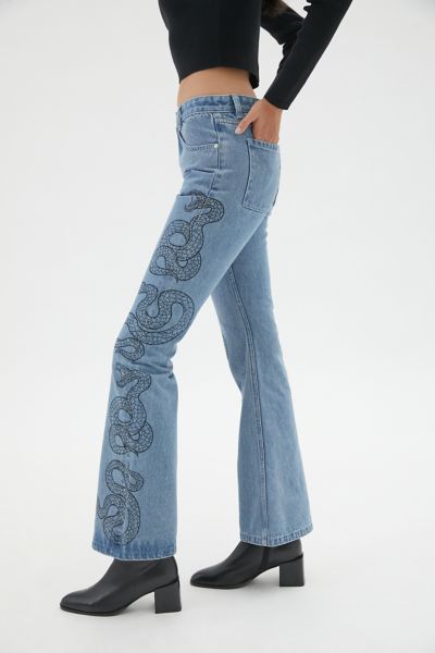 snake print flare jeans