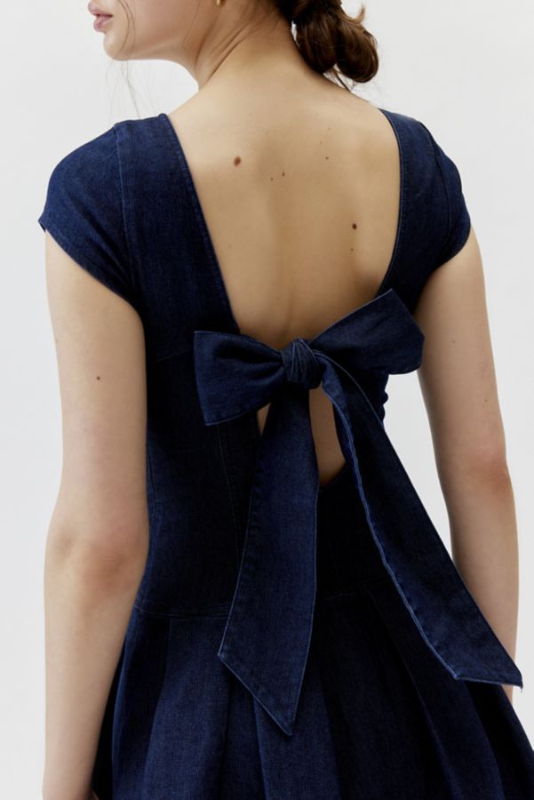 Slide View: 5: UO Bryan Bow-Back Pleated Denim Mini Dress