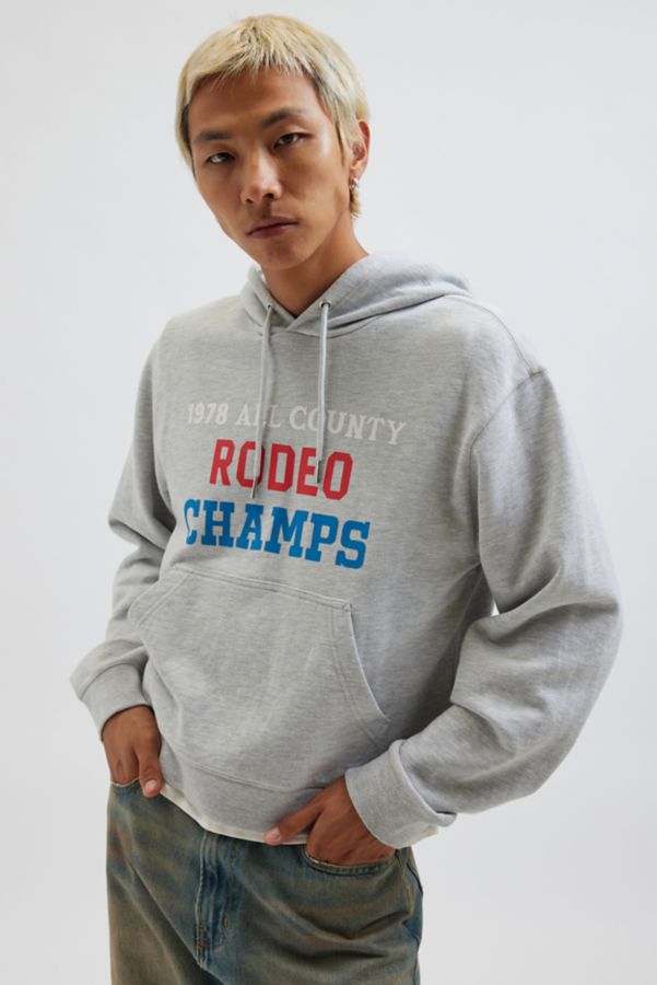 Slide View: 1: BDG Bonfire Rodeo Champs Graphic Print Cropped Hoodie Sweatshirt