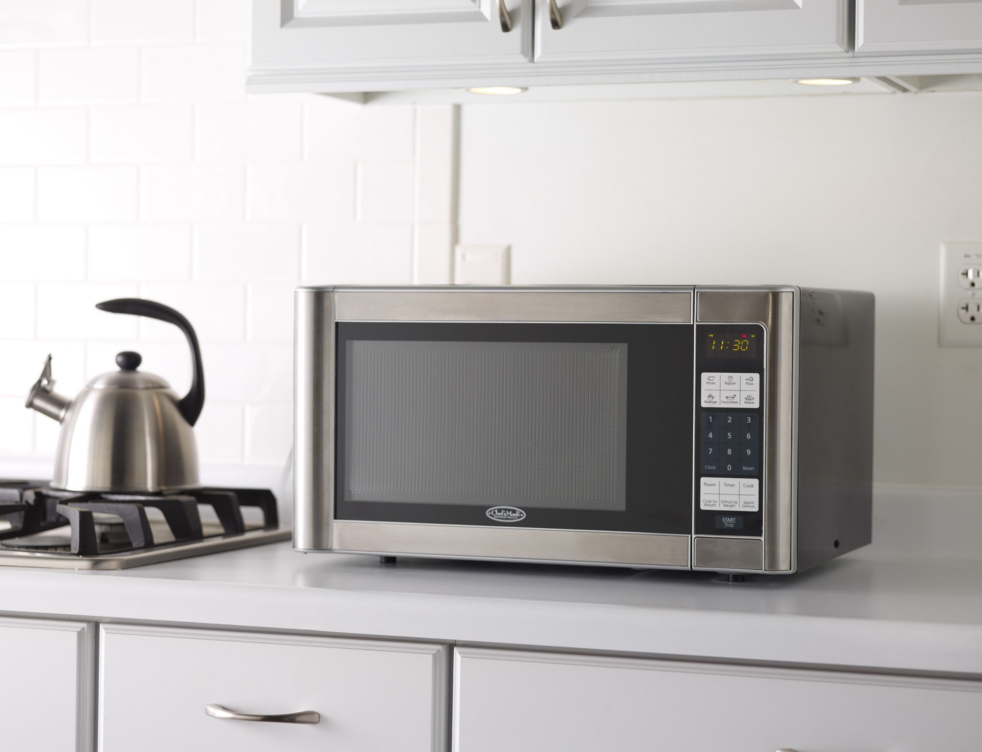 Fingerhut - Oster 1.3 Cu. Ft. 1000-Watt Countertop Microwave Oven with  Stainless Steel Front