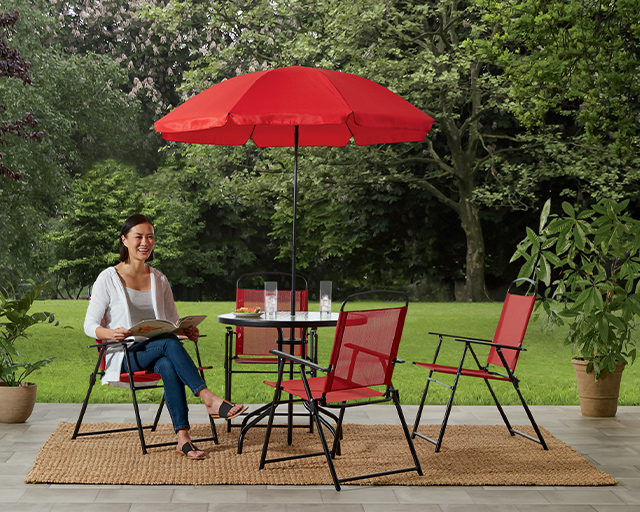 red outdoor patio set with umbrella