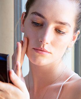model using laura mercier skin cleanser