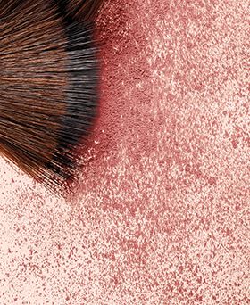 closeup of brush and shimmery blush